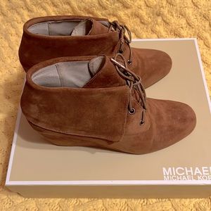 MICHAEL Michael Kors suede wedge boots in a cognac color.